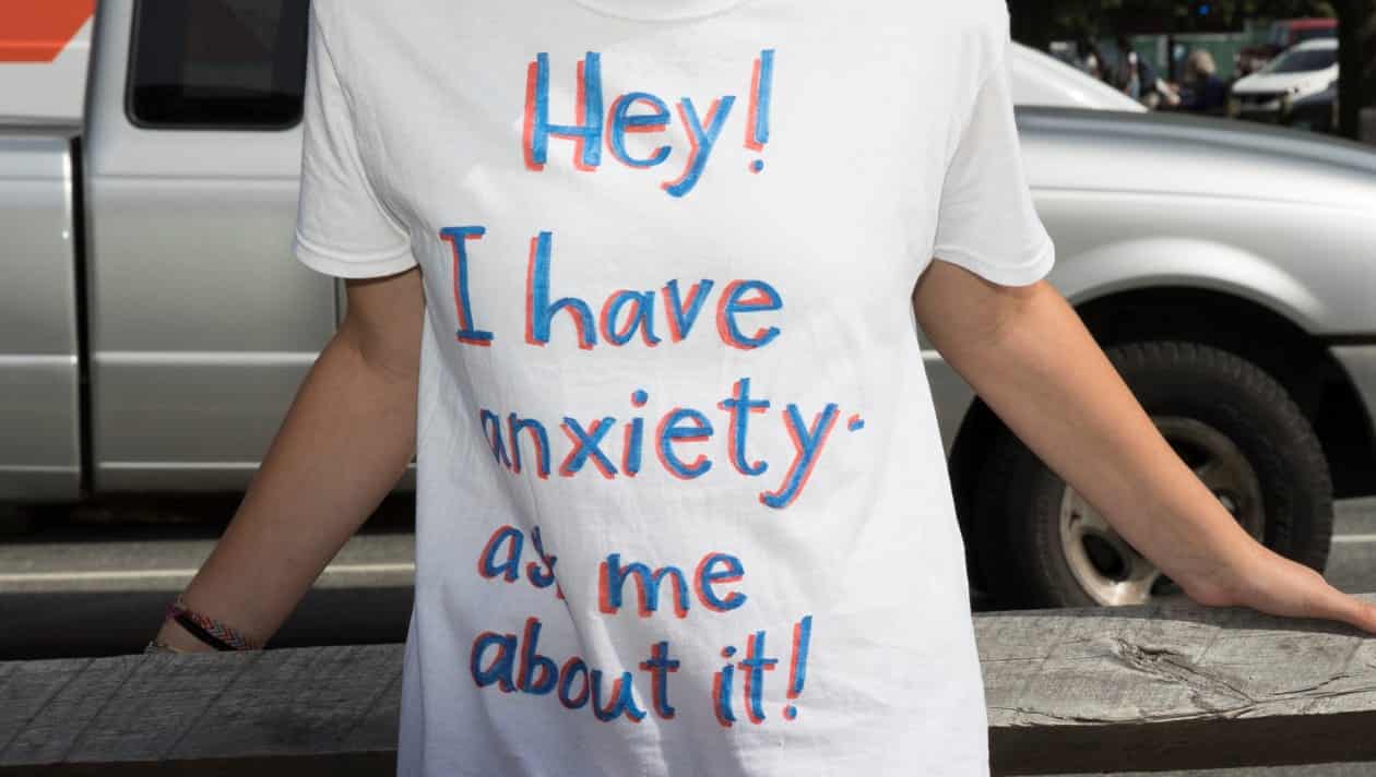 Student wearing a shirt that says Hey I have anxiety, ask me about it