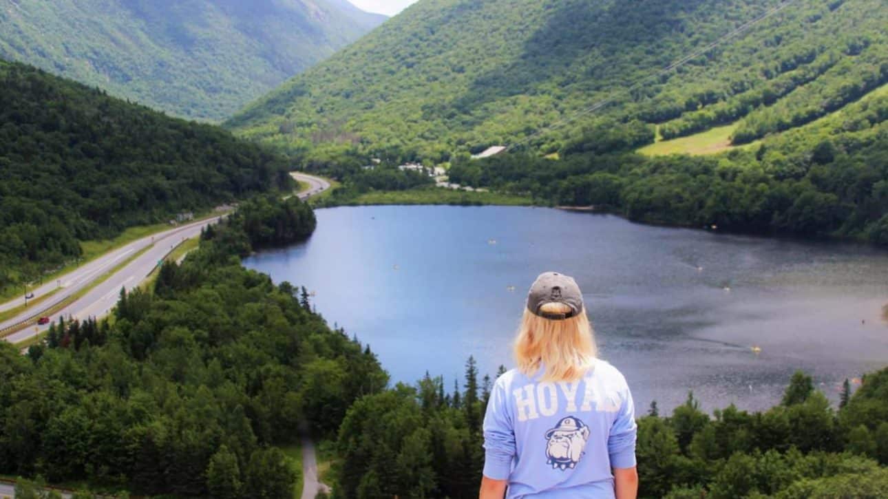Teenage girl admiring a mountain view
